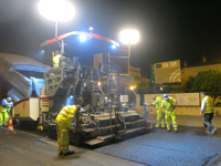 Spreading of the mix with sign in the background Spreading of the mix with sign in the background